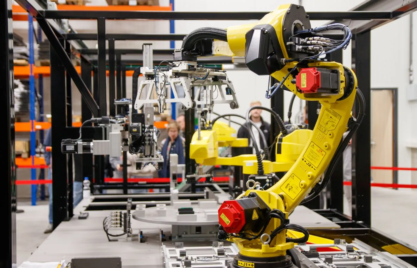 Industrial robot operating inside an automated manufacturing cell
