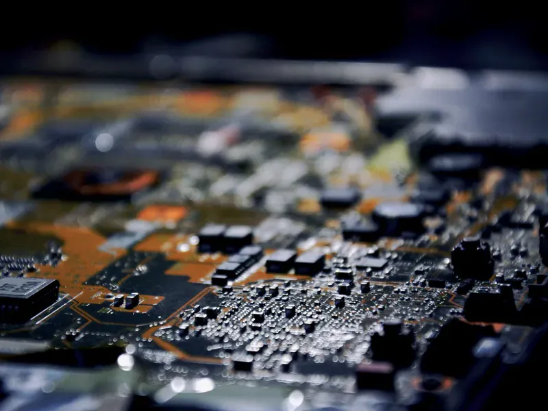 Power electronics components on a circuit board illustrating the analog and embedded categories most exposed to allocation