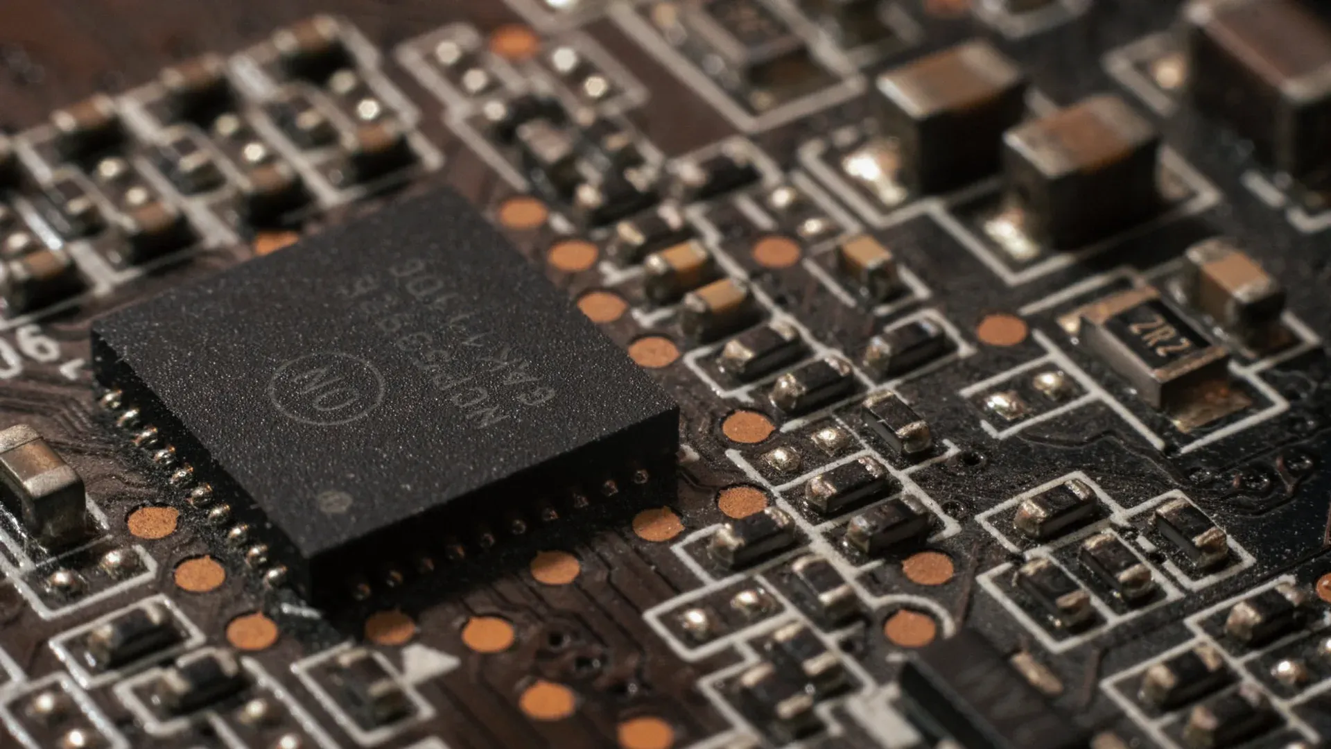 Analog electronic components on a circuit board representing broad-line semiconductor sourcing