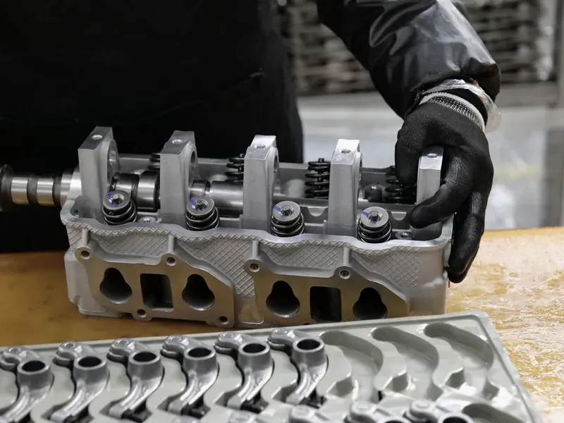 Automotive engine assembly representing vehicle-sector competition for special-purpose logic wafer capacity