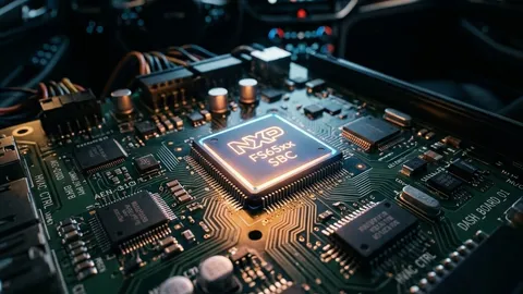 Automotive System Basis Chip glowing on a car dashboard circuit board