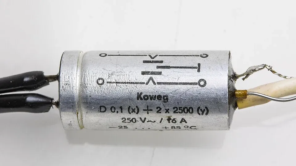 Suppression capacitor with printed X and Y capacitance markings and a connection diagram