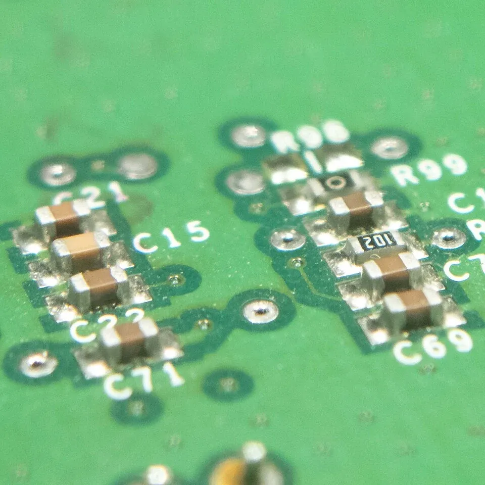 Surface-mount resistors and other small passive components soldered to a circuit board