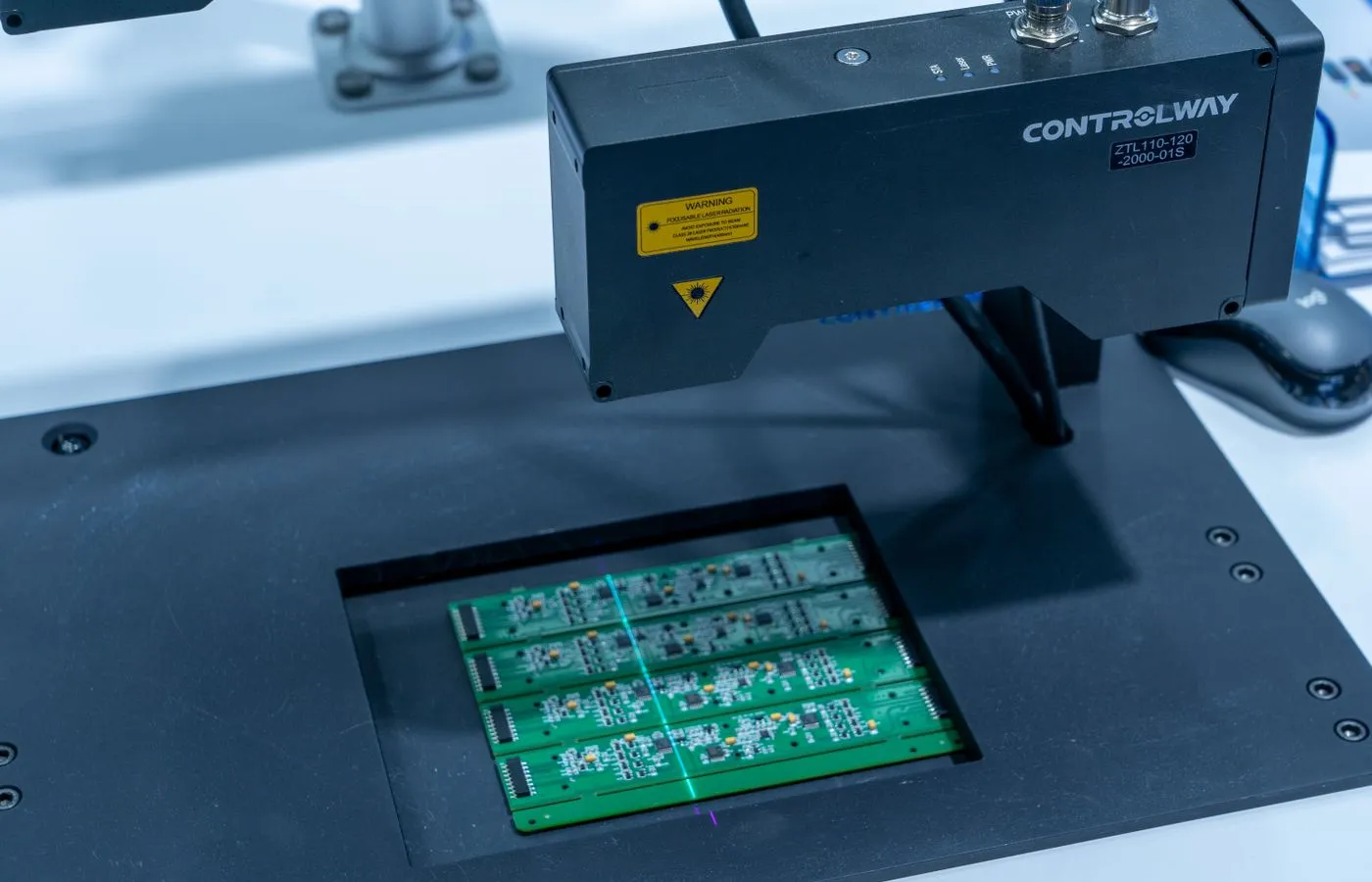Automated optical inspection equipment scanning populated circuit boards