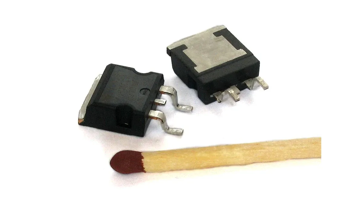 Two power semiconductor packages with exposed metal heat-transfer surfaces