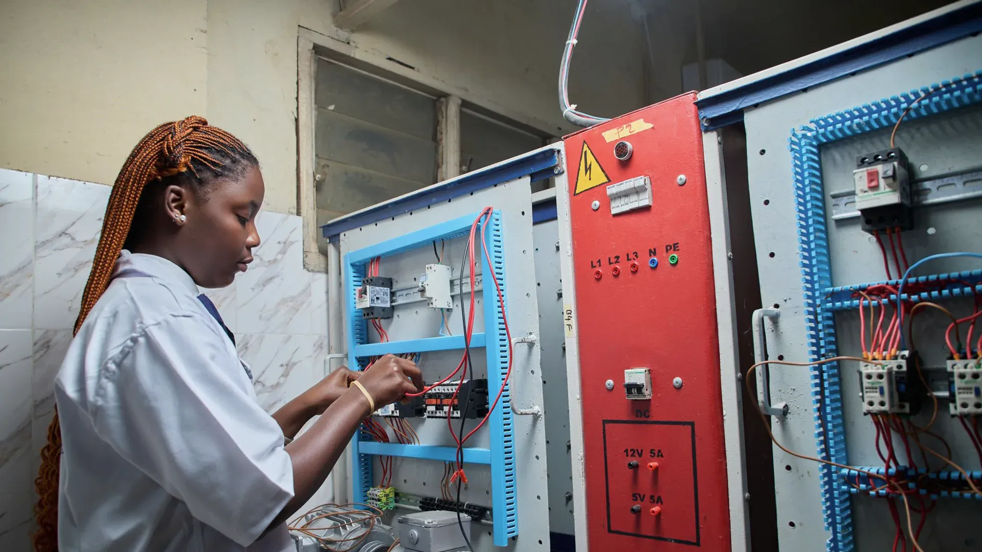 Engineer probing a digital electronics board during interface validation