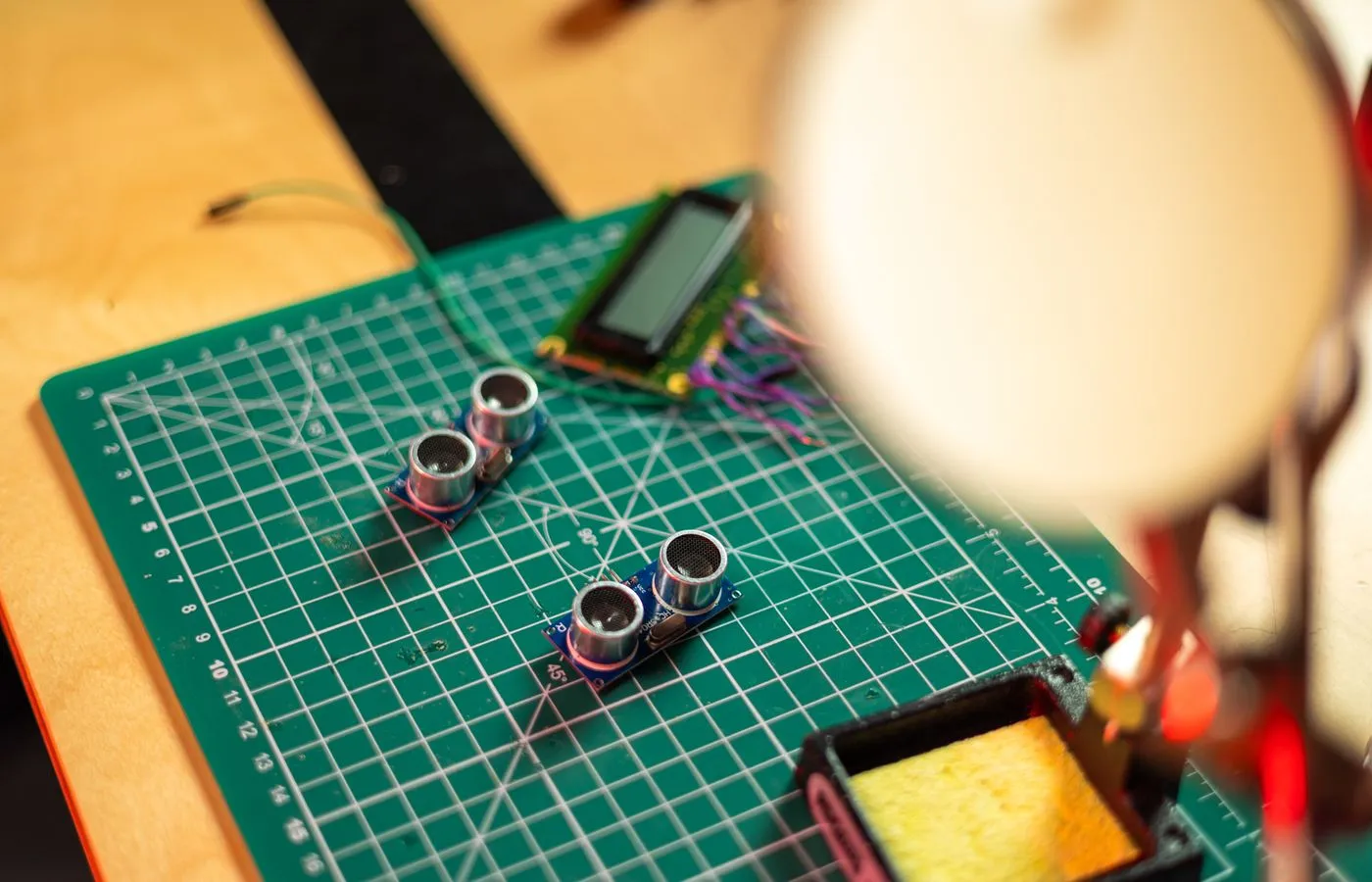 Ultrasonic sensor modules being assembled on an electronics workbench